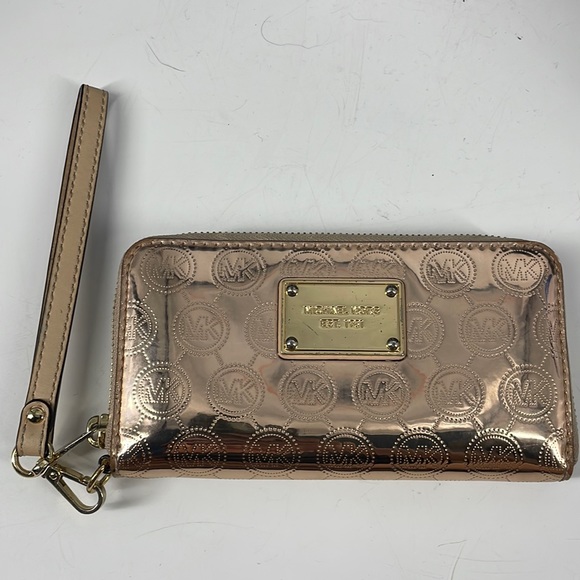 Michael Kors Rose Gold zip around wallet clutch great condition